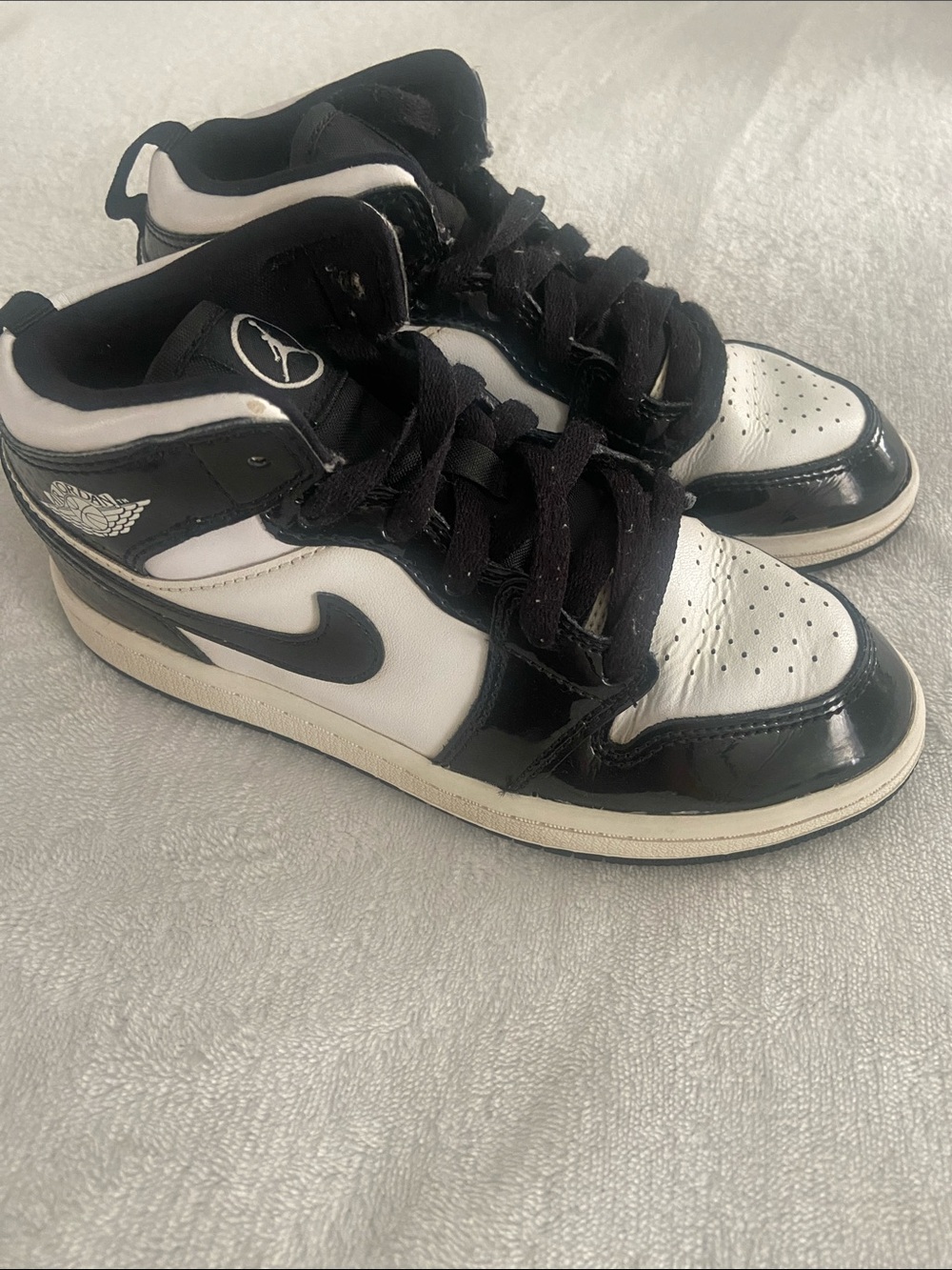 Youth black and white Nike Jordan sneakers